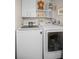 Laundry room equipped with modern appliances and ample storage space at 1621 Gulf Blvd # 407, Clearwater Beach, FL 33767