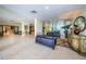 An elegant lobby with tile floors, columns, and comfortable seating areas at 1621 Gulf Blvd # 407, Clearwater Beach, FL 33767