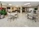 Inviting lounge with comfortable seating, dining tables, and kitchen at 1621 Gulf Blvd # 407, Clearwater Beach, FL 33767