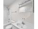 Clean, well-lit bathroom with white tile surround shower and vanity at 17023 Alderman Turner Rd, Wimauma, FL 33598