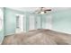 Large bedroom with carpeted floor, standard closet, and ceiling fan with lighting at 17023 Alderman Turner Rd, Wimauma, FL 33598