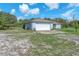 Well-maintained home with an attached two-car garage and ample yard space at 17023 Alderman Turner Rd, Wimauma, FL 33598