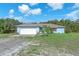 Charming single-story home with a two-car garage and well-maintained lawn at 17023 Alderman Turner Rd, Wimauma, FL 33598