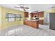 Bright kitchen and breakfast nook with wood cabinets and large window for natural light at 17023 Alderman Turner Rd, Wimauma, FL 33598