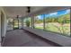 A spacious screened porch offering beautiful views of the surrounding nature and landscape at 17023 Alderman Turner Rd, Wimauma, FL 33598