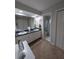 Bathroom with dual sinks and a separate toilet/shower room at 210 Kingsway Dr, Temple Terrace, FL 33617