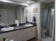 Bathroom with dual sinks and a separate toilet/shower room at 210 Kingsway Dr, Temple Terrace, FL 33617