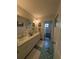 Bathroom with dual sinks and a separate toilet/shower room at 210 Kingsway Dr, Temple Terrace, FL 33617