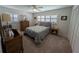 Bedroom with carpeted floors and shutters at 210 Kingsway Dr, Temple Terrace, FL 33617