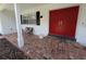 Welcoming front porch featuring double doors, brick steps, and a bench at 210 Kingsway Dr, Temple Terrace, FL 33617