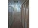 Hallway with carpeted floors and closet storage at 210 Kingsway Dr, Temple Terrace, FL 33617