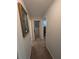 Hallway with carpeted floors at 210 Kingsway Dr, Temple Terrace, FL 33617