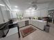 Spacious kitchen with white cabinets, stainless appliances, and plenty of countertop space at 210 Kingsway Dr, Temple Terrace, FL 33617