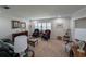 Inviting living room with comfortable seating, classic decor, and neutral carpeting at 210 Kingsway Dr, Temple Terrace, FL 33617