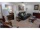 Living room showcases comfortable seating, stylish decor, and a view into the office at 210 Kingsway Dr, Temple Terrace, FL 33617