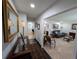 Welcoming foyer leading to a living room with hardwood and carpet flooring at 210 Kingsway Dr, Temple Terrace, FL 33617