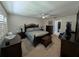 Comfortable main bedroom with carpeted floor, ceiling fan, walk-in closet, and en-suite bathroom at 210 Kingsway Dr, Temple Terrace, FL 33617