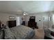 Comfortable main bedroom with carpeted floor, ceiling fan, walk-in closet, and en-suite bathroom at 210 Kingsway Dr, Temple Terrace, FL 33617