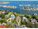 Aerial image of the property with a large pool, boat dock, and waterfront access at 224 Harbor View Ln, Largo, FL 33770