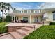 Spacious back patio featuring an outdoor kitchen and grill area, perfect for entertaining and enjoying outdoor meals at 224 Harbor View Ln, Largo, FL 33770