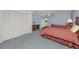 This bedroom has two beds, an outdoor view from the balcony, and a built in closet at 224 Harbor View Ln, Largo, FL 33770