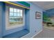 Bedroom window nook overlooking backyard pool with a cushioned bench for relaxing at 224 Harbor View Ln, Largo, FL 33770