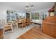 Bright dining room boasts beautiful views, hardwood floors, and natural light at 224 Harbor View Ln, Largo, FL 33770