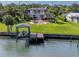 This canal-front property boasts a private boat dock with a lift, providing easy access to waterways at 224 Harbor View Ln, Largo, FL 33770