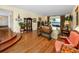 Bright living room featuring hardwood floors, a water view, and charming decor at 224 Harbor View Ln, Largo, FL 33770