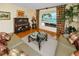 Cozy living room with water view, hardwood floors, and comfortable seating at 224 Harbor View Ln, Largo, FL 33770