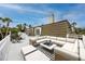 This rooftop deck features a sectional sofa, lounge area, and a view of the surrounding neighborhood at 224 Harbor View Ln, Largo, FL 33770