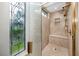 Modern shower with frameless glass doors, custom tile, and a built-in bench at 224 Harbor View Ln, Largo, FL 33770