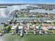 Beautiful aerial view showcasing waterfront homes with boat docks and ocean access at 241 176Th Terrace E Dr, Redington Shores, FL 33708