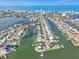 Expansive aerial view showcasing waterfront properties, canals, and open ocean at 241 176Th Terrace E Dr, Redington Shores, FL 33708