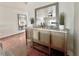 Stylish bar area with a mirror, cabinet storage, countertop and decorative plants for an inviting atmosphere at 241 176Th Terrace E Dr, Redington Shores, FL 33708