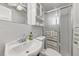 Cozy bathroom featuring a toilet, sink, and glass shower at 241 176Th Terrace E Dr, Redington Shores, FL 33708