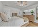 Comfortable bedroom with natural light, ceiling fan, and a dresser with storage at 241 176Th Terrace E Dr, Redington Shores, FL 33708