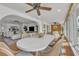 Dining room showcases ceiling fan and a view of the living room at 241 176Th Terrace E Dr, Redington Shores, FL 33708