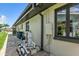 Side view of the home's exterior showing the filtration system at 241 176Th Terrace E Dr, Redington Shores, FL 33708