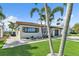 Beautiful single-story home with a landscaped yard and paver walkway at 241 176Th Terrace E Dr, Redington Shores, FL 33708