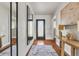 Hallway features mirrors, console table and decor at 241 176Th Terrace E Dr, Redington Shores, FL 33708