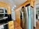Spacious kitchen with stainless steel appliances and matching custom cabinets at 241 176Th Terrace E Dr, Redington Shores, FL 33708