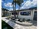 Home featuring well-maintained landscaping and beautiful walkway at 241 176Th Terrace E Dr, Redington Shores, FL 33708