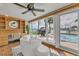 Bright living area features a desk, large windows offering water views, and comfortable seating at 241 176Th Terrace E Dr, Redington Shores, FL 33708
