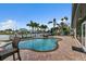 Backyard pool with adjacent dock and waterfront views at 241 176Th Terrace E Dr, Redington Shores, FL 33708