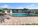Inviting backyard pool and patio area with clear water and brick pavers at 241 176Th Terrace E Dr, Redington Shores, FL 33708