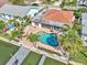 Aerial view featuring a pool, patio and private boat dock on a waterfront property at 241 176Th Terrace E Dr, Redington Shores, FL 33708