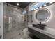 Modern bathroom featuring a glass shower and sleek vanity at 27528 Water Ash Dr, Wesley Chapel, FL 33544