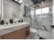 Bathroom featuring wood cabinets, marble countertops, and walk-in shower at 27528 Water Ash Dr, Wesley Chapel, FL 33544