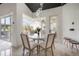 Breakfast nook featuring marble floors, a marble table, and view of the pool area at 27528 Water Ash Dr, Wesley Chapel, FL 33544